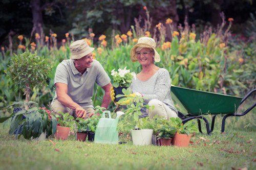 Gardener discussing a garden plan at the front gate